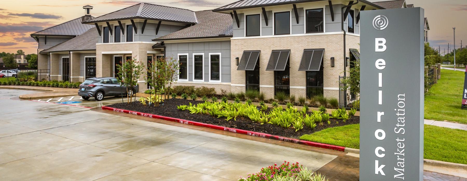 a building with a sign in front reading belrock