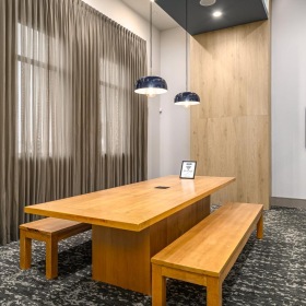 a work room with a long table and benches