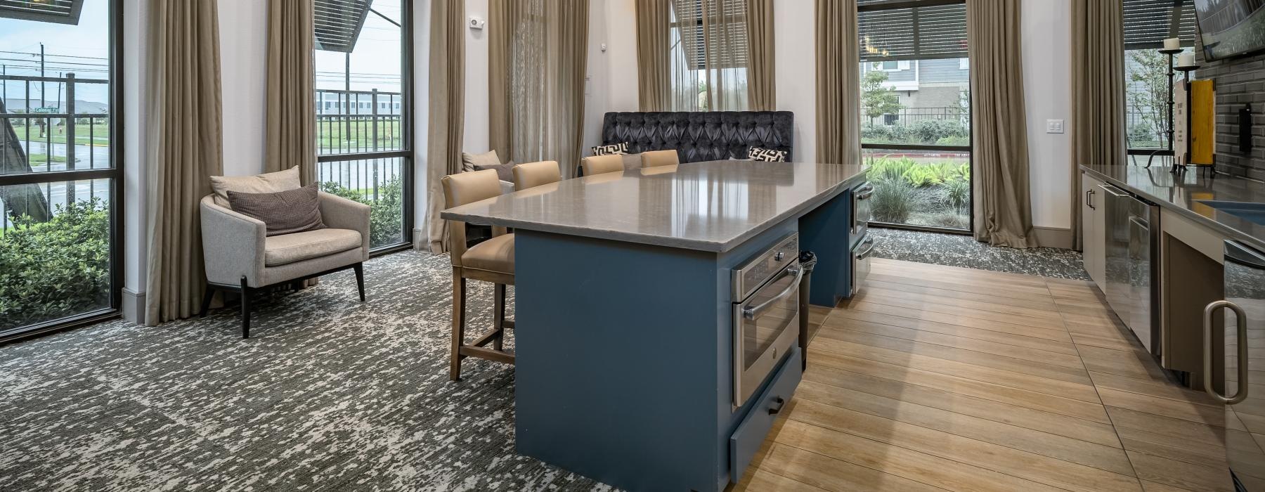 a lounge room with a bar table and chairs